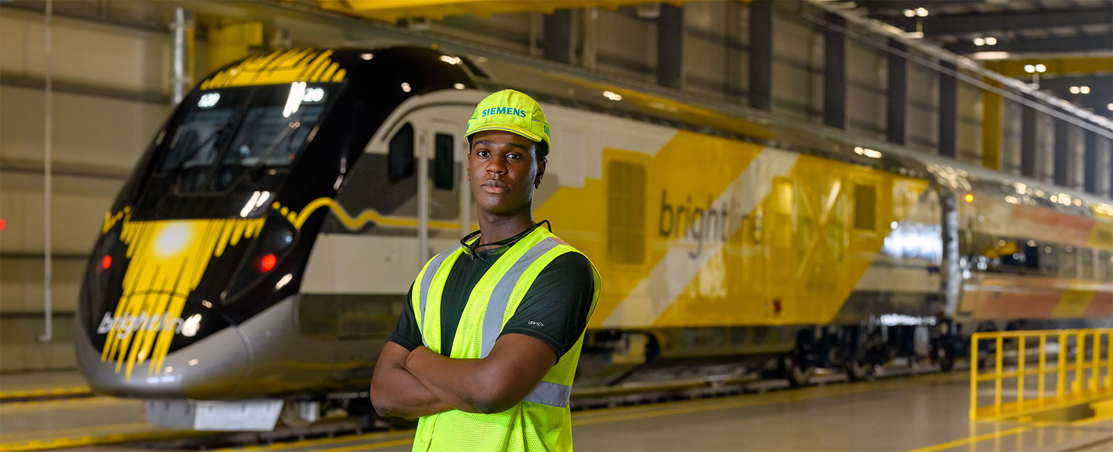 Carl Roc in front of Brightline Train