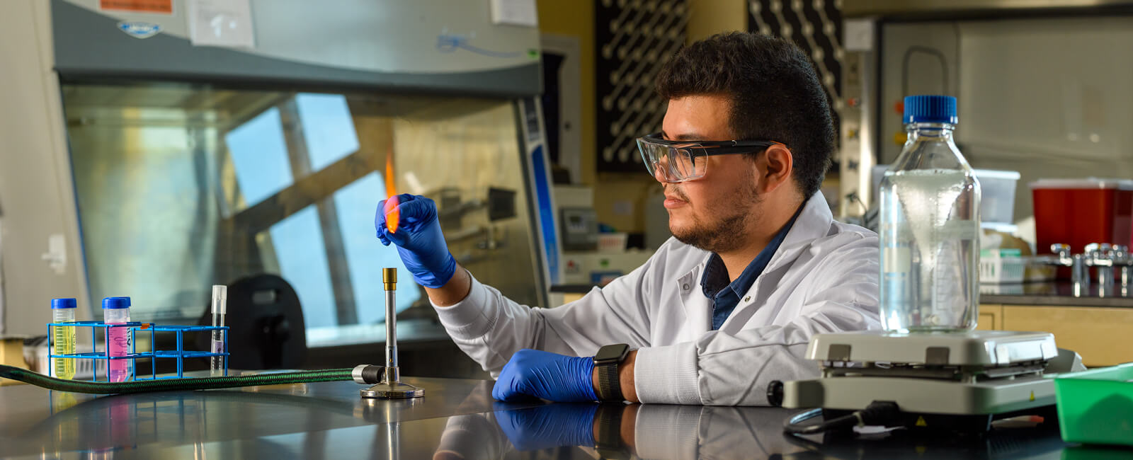 Oscar Camargo lights a burner in the lab