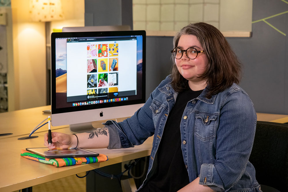 Reina Castellanos at desk